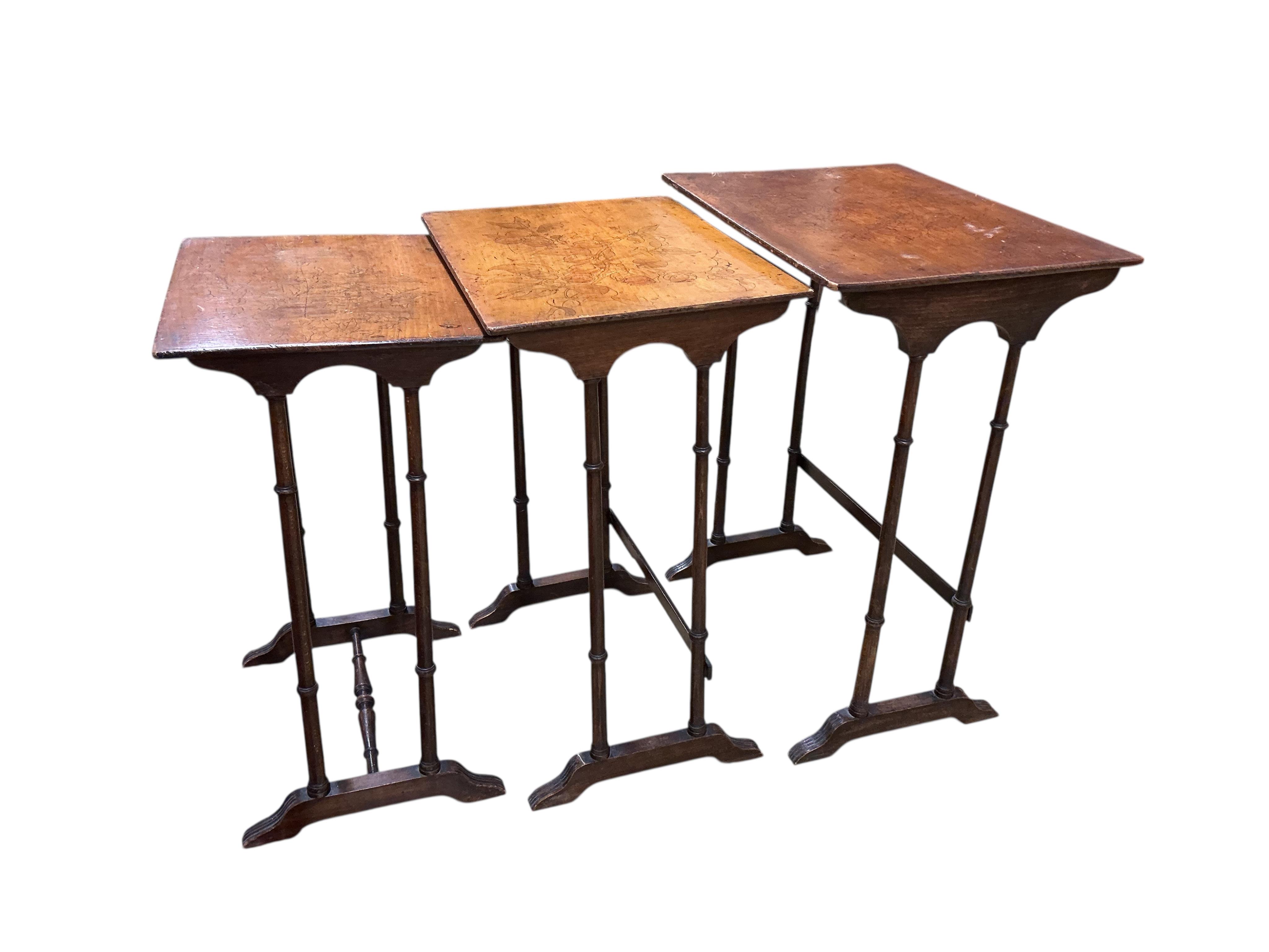 A nest of three beech occasional tables, width 56cm, depth 40cm, height 72cm